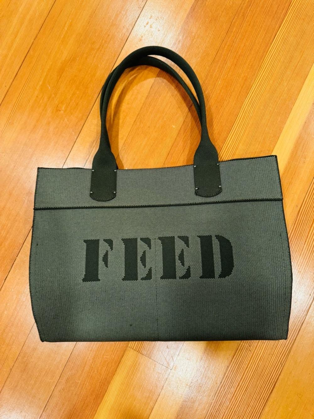 Never used sold out limited edition Rothy’s x FEED tote